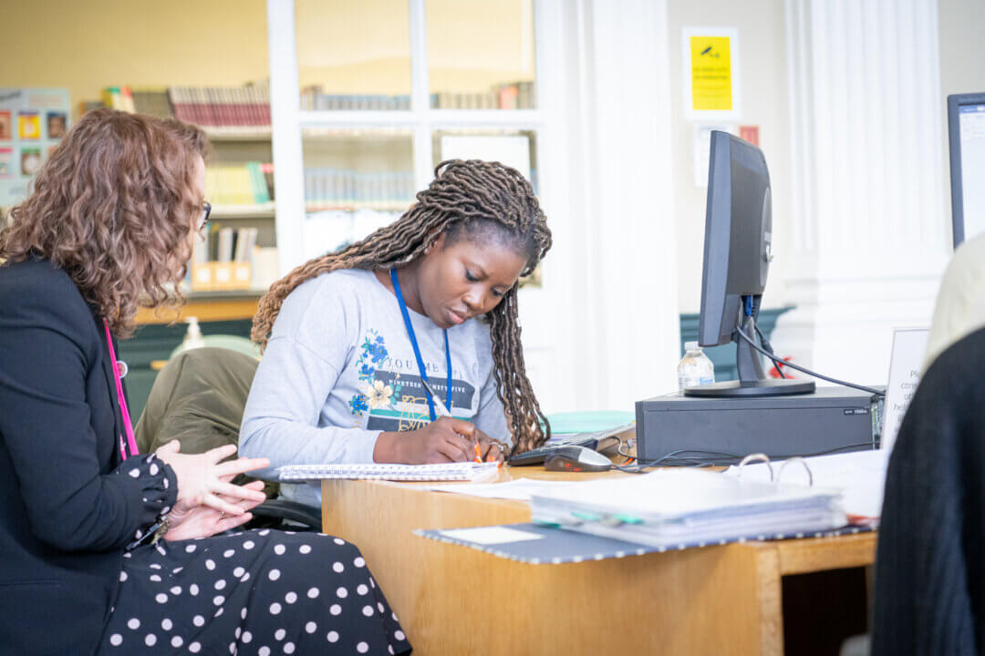 student and tutor working together