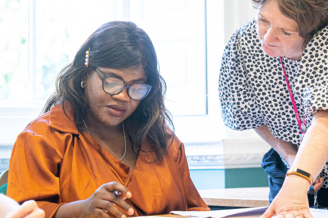 Female student and tutor studying